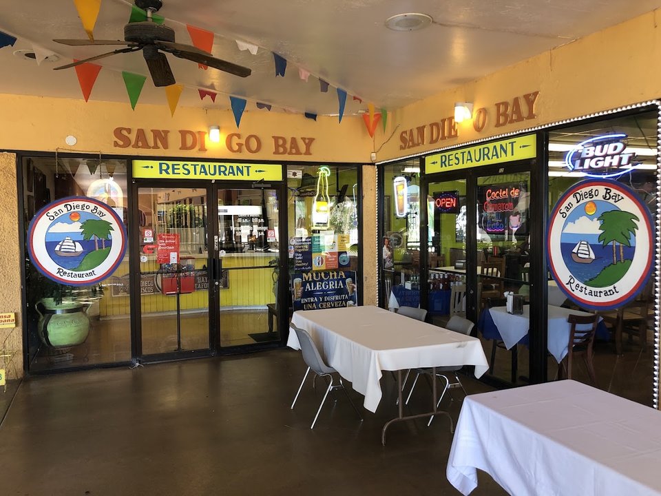 Mariscos restaurant exterior with clear storefront signage.